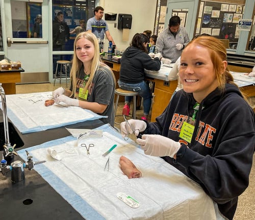 Mazama High School juniors Rylee Blaschke, left, and Meda Lee plan on taking the medical assistant pre-apprenticeship courses as seniors next fall. They are pictured here in their Health Occupations 1 course.